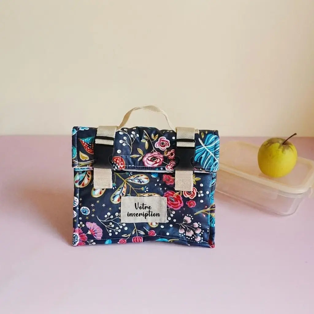 Sac repas bleu nuit à fleurs colorées avec étiquette à personnaliser, vue de face