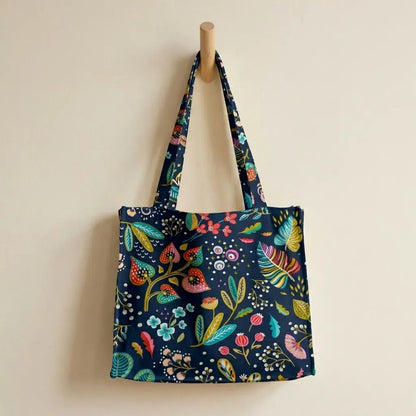 grand sac de plage en coton enduit sombre à motif floral coloré