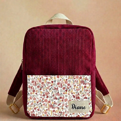 sac à dos enfant velours côtelé lie de vin avec poche florale et étiquette prénom