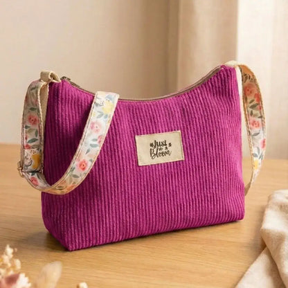 Sac bandoulière magenta en velours côtelé pour femme, design Just Bloom et sangle motifs.