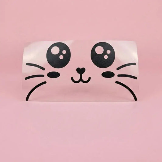 Flex thermocollant Chatoune : grands yeux brillants, pommettes et nez en cœur noirs sur support transparent et fond rose.