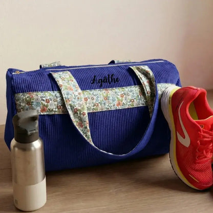 sac polochon velours côtelé bleu roi avec anses tissu fleuri et zip